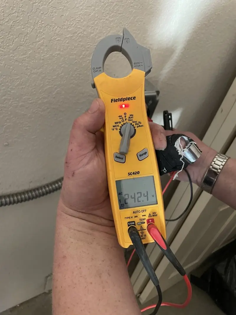 Voltage testing with clamp meter during Generator Installation in Springdale
